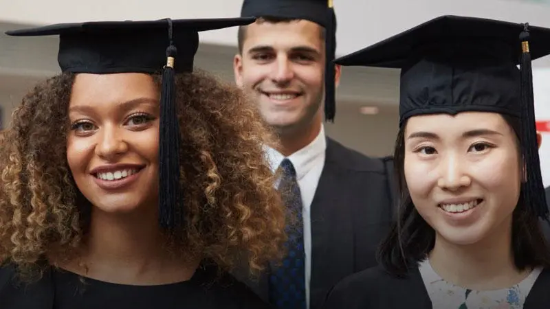 A group of Solent graduates wearing gowns and mortar boards