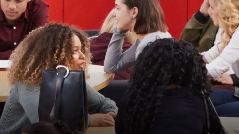 Students talking to each other on the bridge