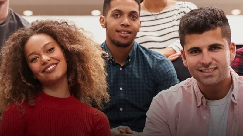 A group of students smiling at the camera