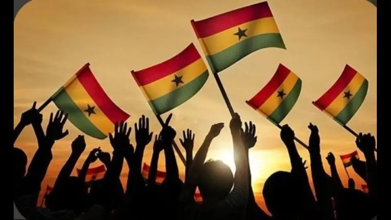 hands waving the flags of Ghana