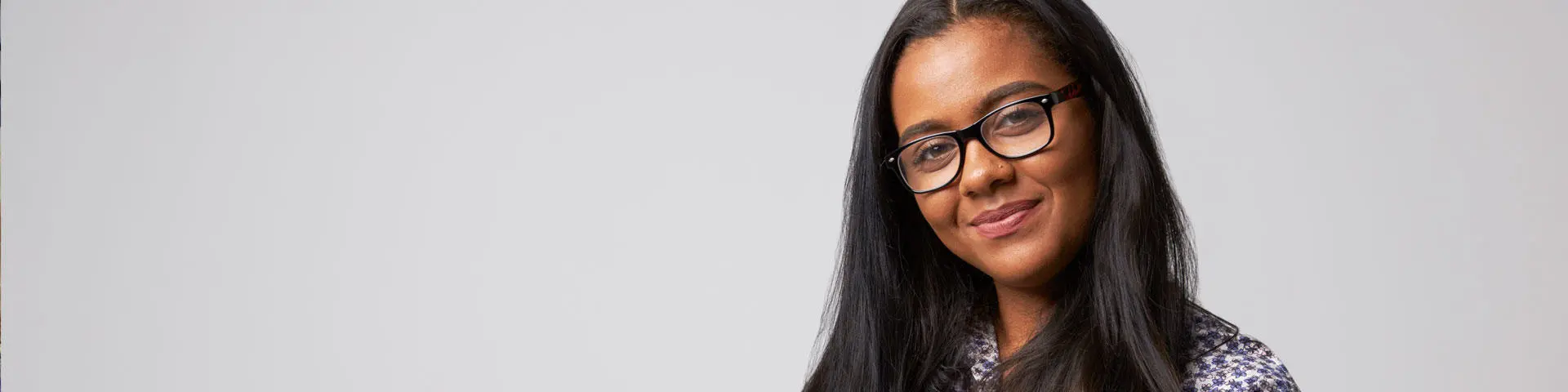 head shot of girl in glasses smiling