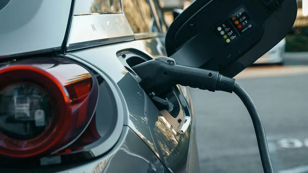 Car with electric charger in side
