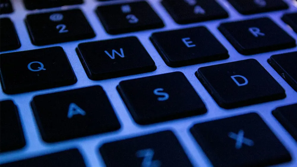 A keyboard lit up blue