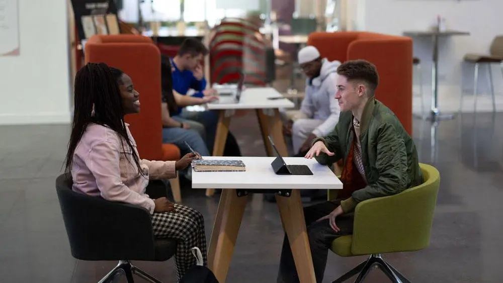 Students using the study space in the Spark Atrium