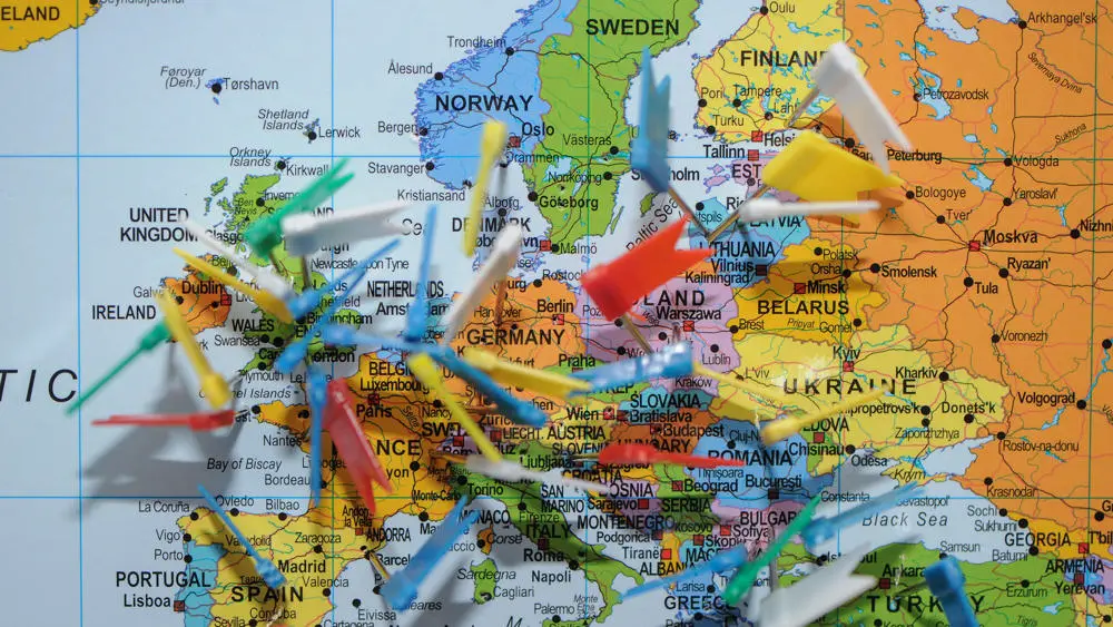 Flag with pins added showing the wide range of loactions Solent students have come from