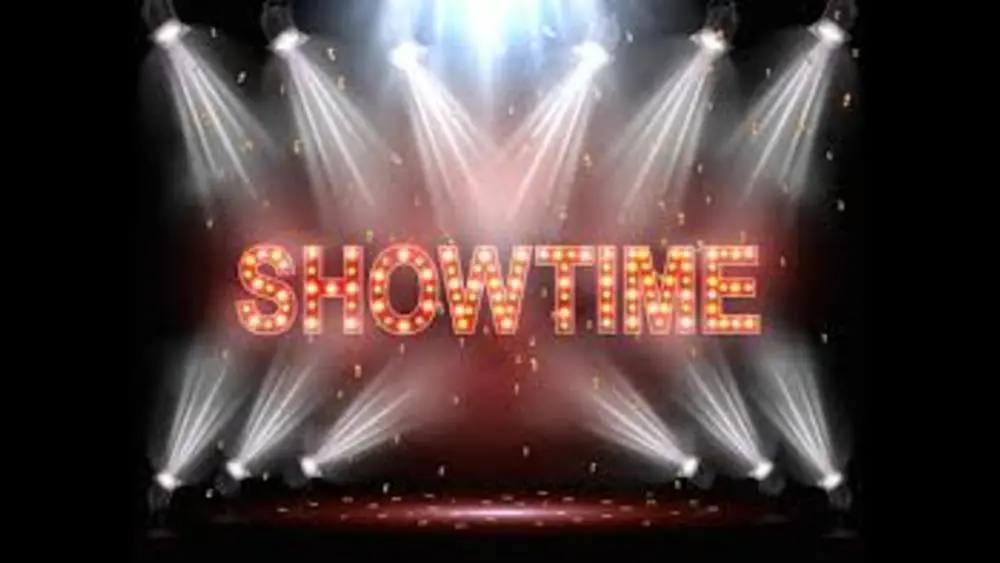 Showtime text in lights with spotlights shining on the words