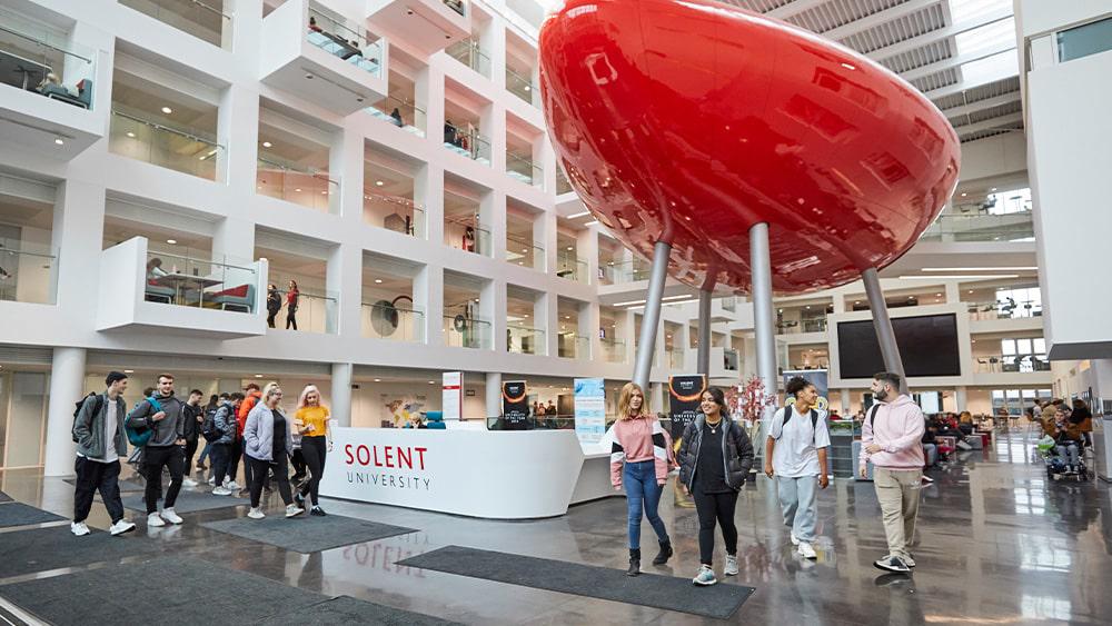 Students walking through the Spark atrium